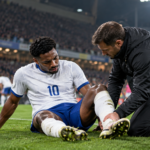 European football injury crisis as a player receives treatment during a match
